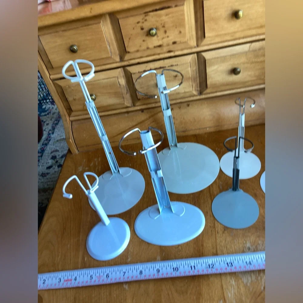 7 doll holders or White and Gray Jewelry Stands